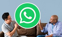 Men showing a WhatsApp Messenger icon