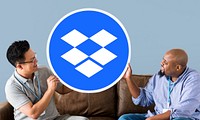 People holding a Dropbox icon