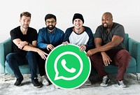 Men showing a WhatsApp Messenger icon