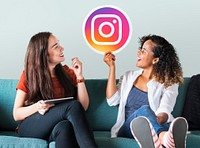 Young women showing an Instagram icon
