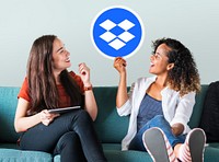 Women holding up a Dropbox icon