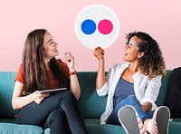 Women holding a Flickr icon