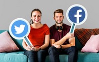 Couple holding social media icons