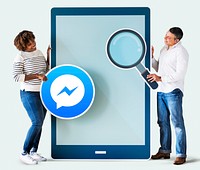 Couple searching for Facebook Messenger on a phone