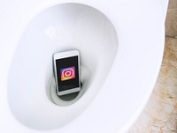 Instagram logo showing on a phone placed in a toilet bowl. BANGKOK, THAILAND, 1 NOV 2018.