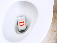 Youtube application showing on a phone in a toilet bowl. BANGKOK, THAILAND, 1 NOV 2018.