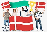 Diverse football fans holding the flag of Denmark