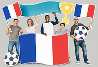 Diverse football fans holding the flag of France