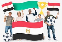 Diverse football fans holding the flag of Egypt