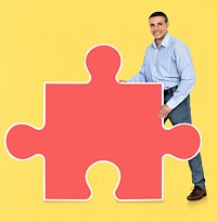 Man holding a jigsaw piece