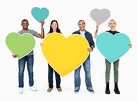 Diverse people holding colorful hearts