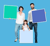 Happy family holding empty square boards
