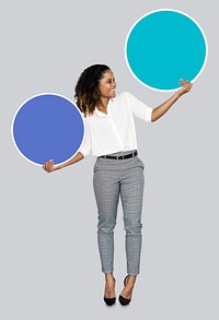 Young businesswoman holding blank circles