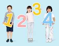Cheerful diverse kids holding numbers one to four