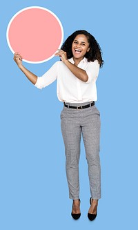 Cheerful businesswoman holding a round empty board