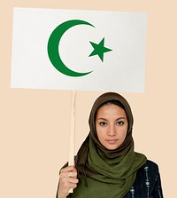 Muslim girl holding a sign