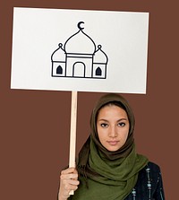 Muslim girl holding a sign