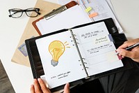 Light bulb drawn on a planner