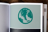 Green globe drawing on a magazine
