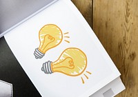 Light bulbs drawing on a book