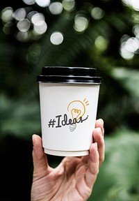 Word hashtag Ideas on a paper coffee cup