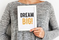 Woman holding a Dream big frame