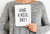 Woman holding a Have a nice day frame