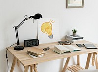 Minimal style workspace with a light bulb drawing