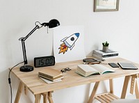 Minimal style workspace with a rocket launch drawing