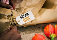 Closeup of Dream big tag on a flower bouquet