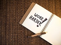 Work harder written on a notebook