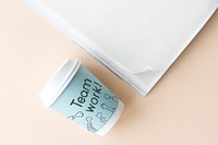 Teamwork written on a paper cup