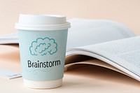 Brainstorm written on a paper cup
