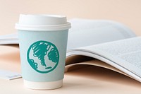 Green globe drawn on a paper cup