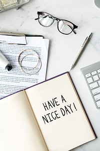 Have a nice day phrase written on a notebook