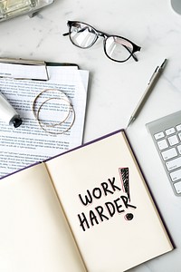 Work harder written on a notebook