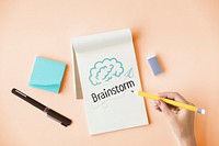 Hand writing Brainstorm on a notepad