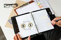 Bitcoin exchange with dollar symbol on a planner