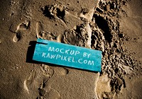Wooden sign in the sand