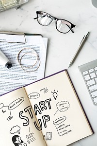 Startup ideas written in a notebook