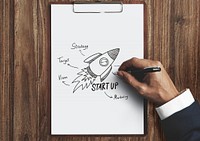 Businessman drawing a startup plan