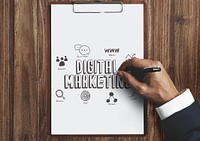 Businessman drawing digital marketing on a clipboard with paper