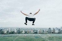 Man jumping on the rooftop, vivid tone