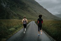 Friends jogging in the Scottish Highlands, vivid tone