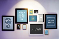 Picture frames with creative illustrations on a wall