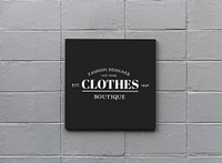 Black sign on a white wall mockup