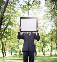 Businessman Holding Picture Frame Copy Space Concept