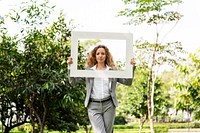 Businesswoman Picture Frame Holding Park Concept