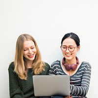 Young women are using computer laptop