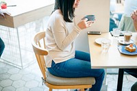 Asian woman sitting in coffee cafe